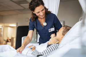 Nurse taking care of little boy